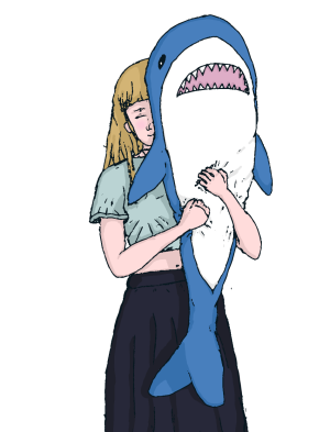 A girl hugging a shark plushie